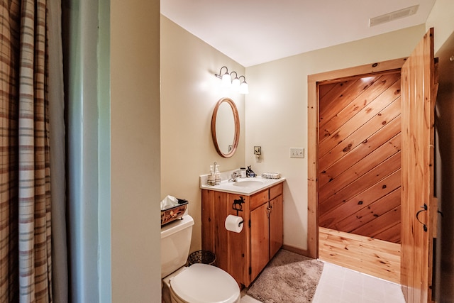 bathroom with vanity and toilet