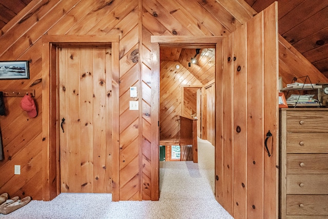 11 Goss Pond Rd, Bethel, ME 04217 - hallway with wood walls, carpet floors, and vaulted ceiling