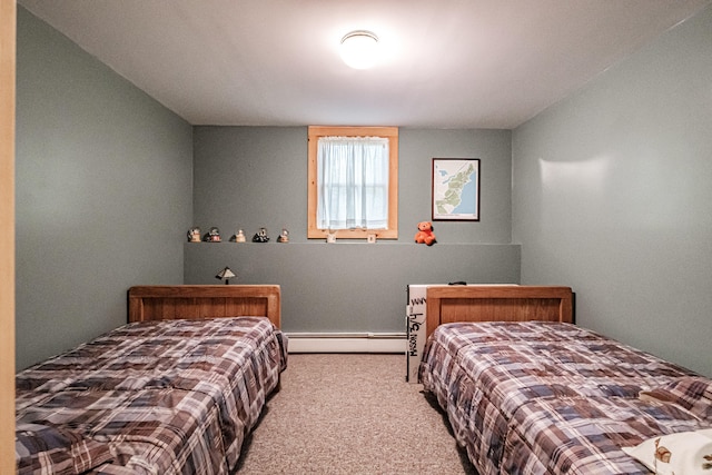 carpeted bedroom with a baseboard heating unit