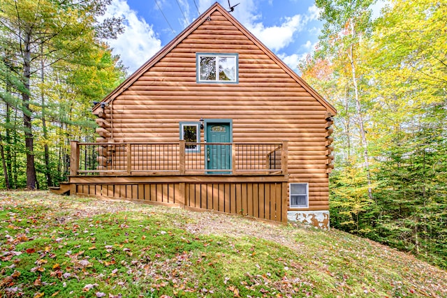 view of side of home with a wooden deck