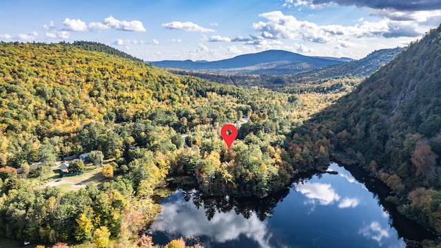 aerial view featuring a water and mountain view