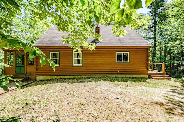 11 Goss Pond Rd, Bethel, ME 04217 - rear view of property featuring a chimney, log exterior, and a shingled roof