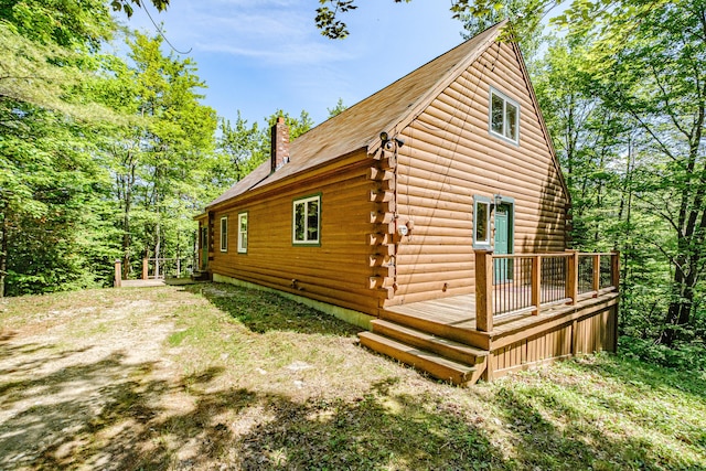11 Goss Pond Rd, Bethel, ME 04217 - view of property exterior with a chimney, log siding, and a wooden deck