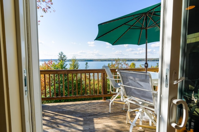 wooden deck featuring a water view