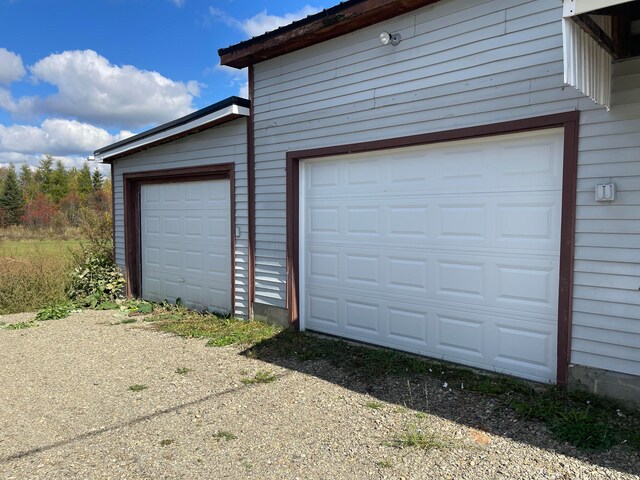 garage with wood walls