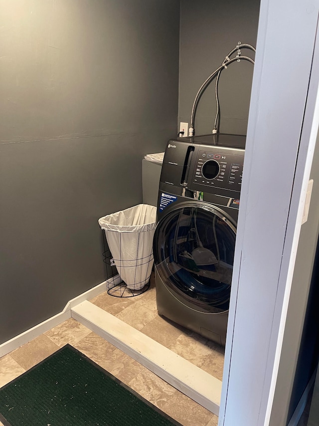 washroom with washer / dryer