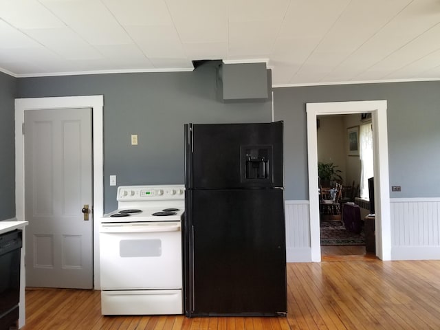 kitchen featuring black appliances, ornamental molding, and light hardwood / wood-style flooring