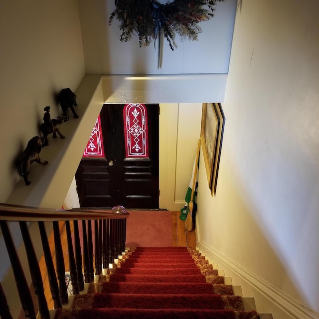 staircase with carpet flooring