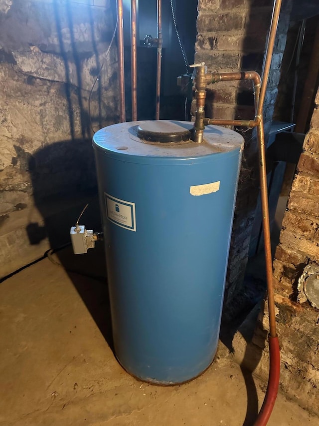 utility room featuring electric water heater