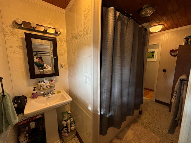 bathroom with wooden ceiling, tile walls, ornamental molding, and a shower with curtain