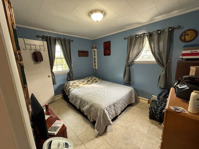 bedroom featuring ornamental molding and multiple windows