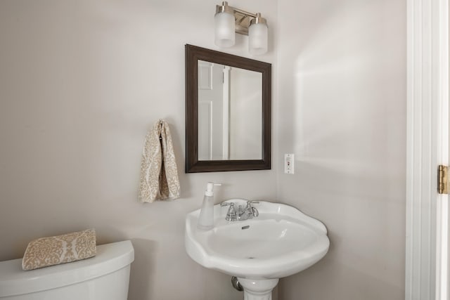 bathroom featuring sink and toilet