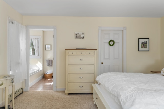 bedroom with a baseboard radiator and light colored carpet