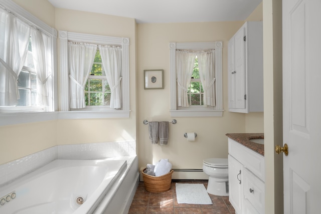 bathroom with vanity, toilet, a washtub, and a healthy amount of sunlight