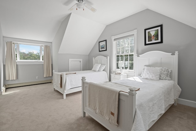 bedroom featuring multiple windows, vaulted ceiling, a baseboard heating unit, and ceiling fan