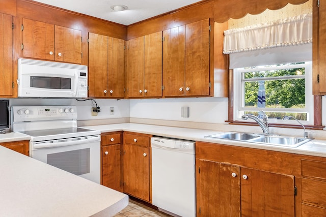 kitchen featuring white appliances and sink