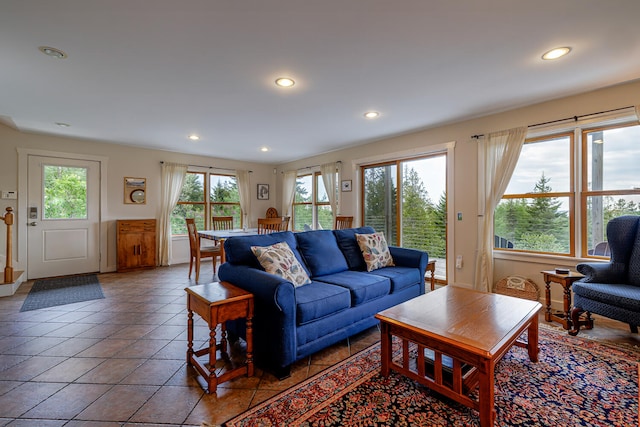 living room featuring a healthy amount of sunlight and tile patterned floors