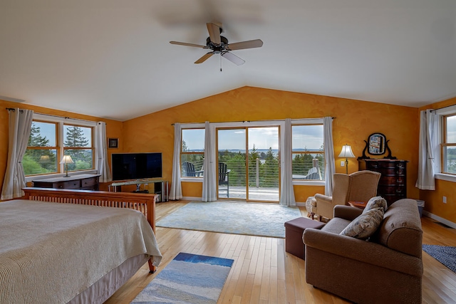 bedroom with vaulted ceiling, ceiling fan, light hardwood / wood-style flooring, and access to exterior