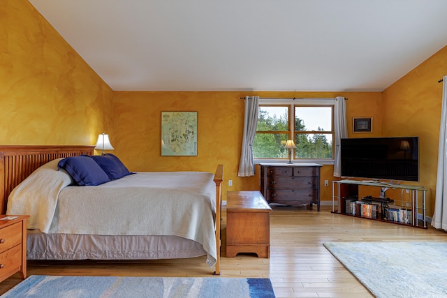 bedroom with light wood-type flooring