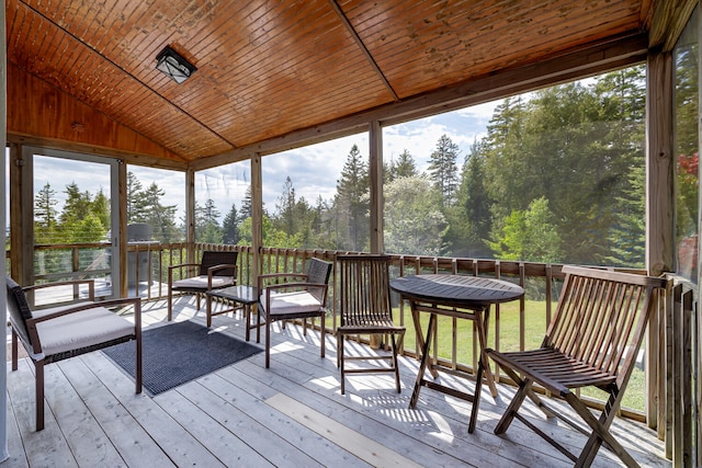 sunroom featuring wood ceiling and vaulted ceiling