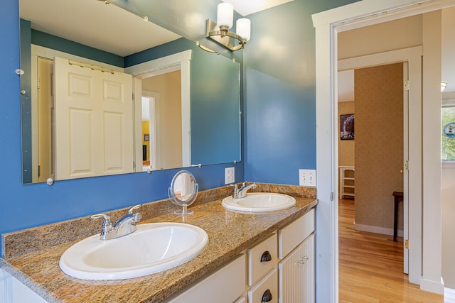 bathroom with wood-type flooring and vanity