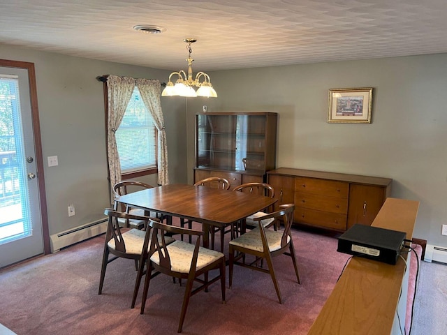 carpeted dining area featuring a notable chandelier, a healthy amount of sunlight, and a baseboard heating unit