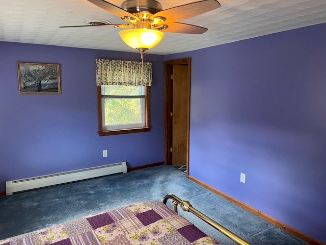 carpeted empty room featuring ceiling fan and a baseboard radiator