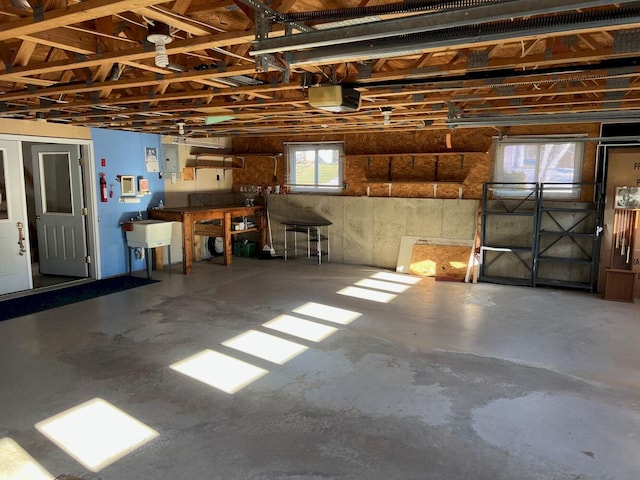 garage with sink and a garage door opener