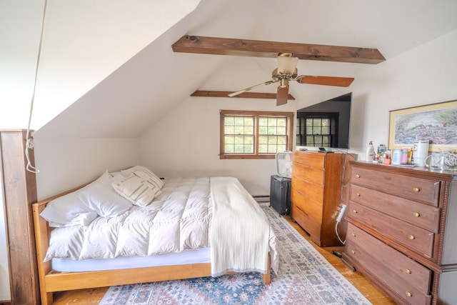 bedroom with ceiling fan, lofted ceiling with beams, and a baseboard heating unit