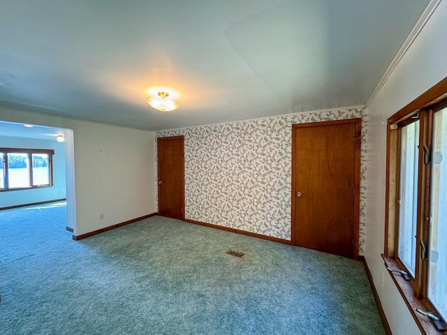 carpeted empty room with ornamental molding