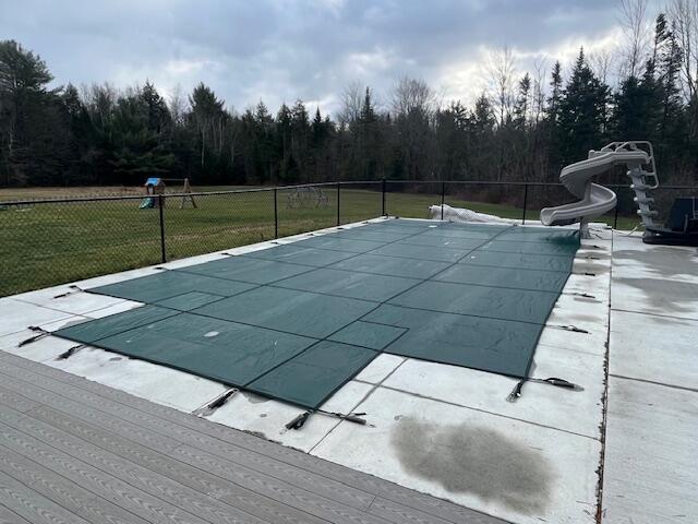 473 Wolfboro Rd, Stetson, ME 04488 - view of pool featuring fence, a water slide, a yard, and a fenced in pool
