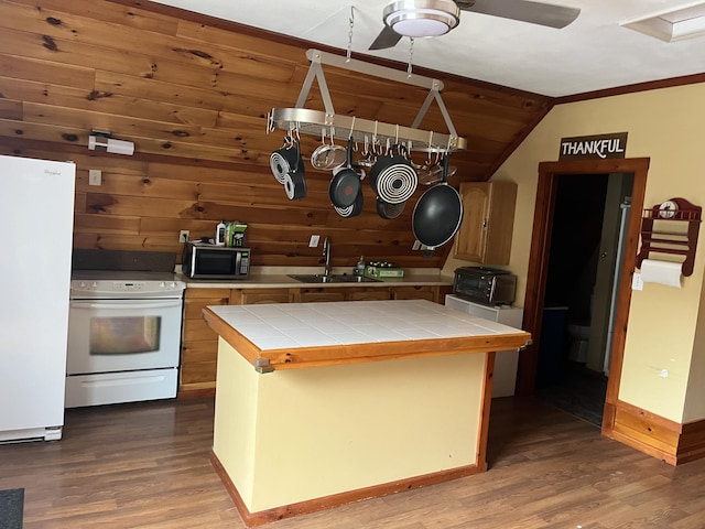 473 Wolfboro Rd, Stetson, ME 04488 - kitchen with a sink, tile counters, wood finished floors, and white appliances