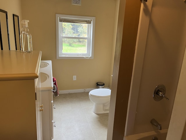 473 Wolfboro Rd, Stetson, ME 04488 - full bath with visible vents, baseboards, toilet, vanity, and bathtub / shower combination