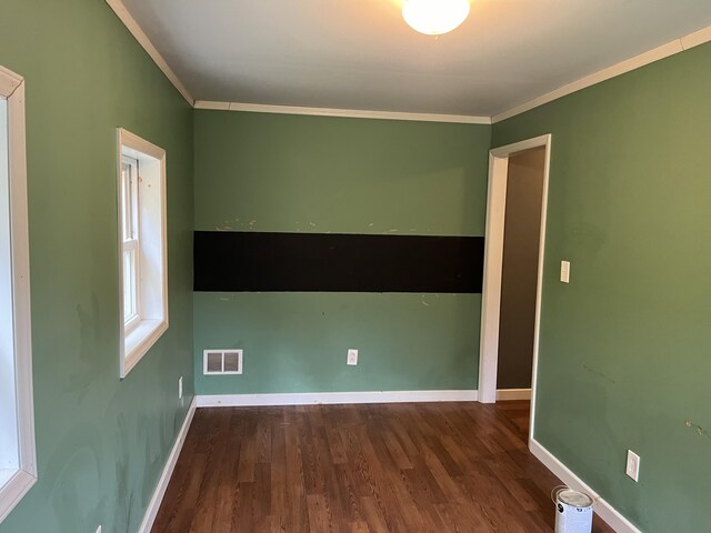 473 Wolfboro Rd, Stetson, ME 04488 - spare room featuring wood finished floors, a wealth of natural light, ornamental molding, baseboards, and visible vents