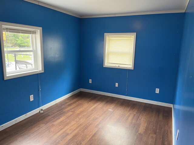 473 Wolfboro Rd, Stetson, ME 04488 - empty room featuring wood finished floors, ornamental molding, and baseboards