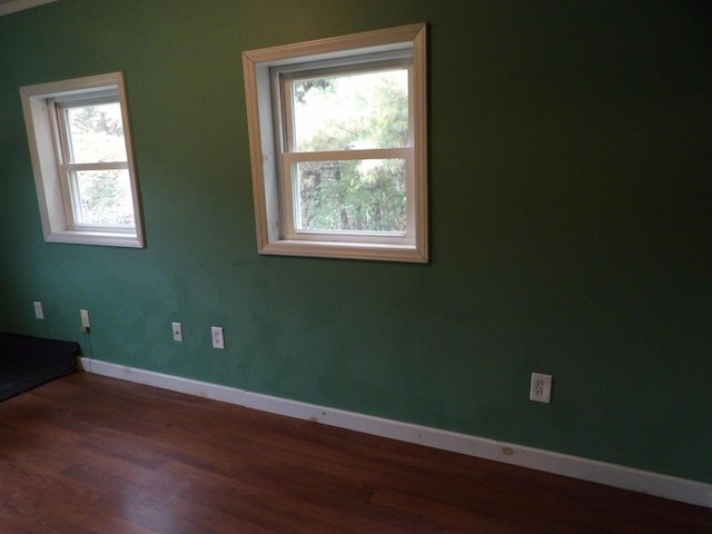 473 Wolfboro Rd, Stetson, ME 04488 - spare room with wood finished floors, plenty of natural light, and baseboards
