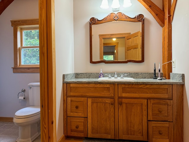 bathroom with tile patterned floors, vanity, and toilet