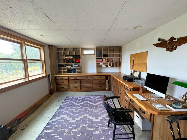 office area with concrete flooring