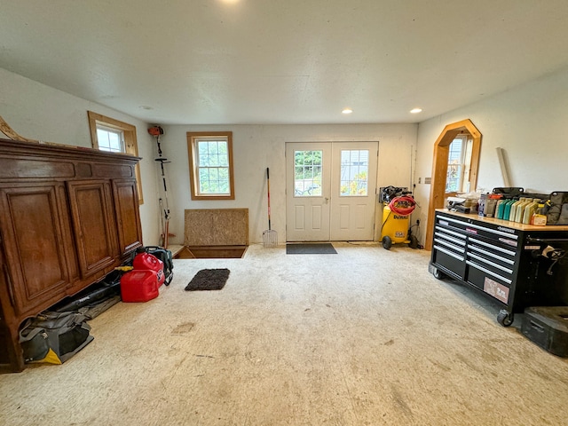 misc room featuring light colored carpet