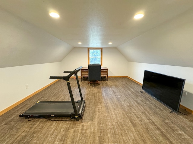 exercise area with vaulted ceiling