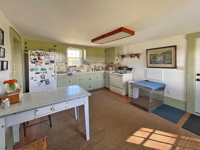 kitchen featuring green cabinetry and white appliances