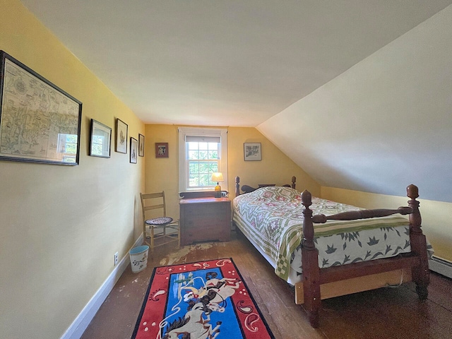 bedroom with lofted ceiling and dark hardwood / wood-style floors