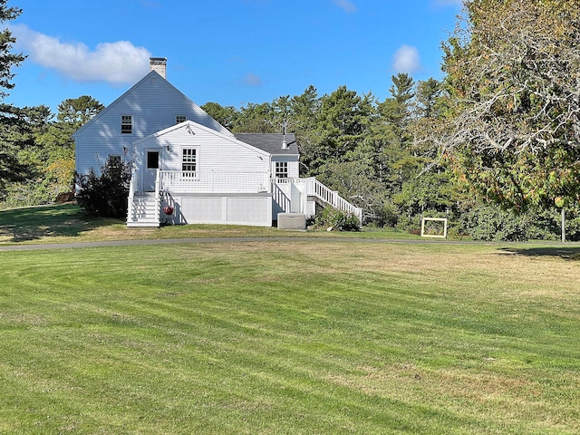 view of side of property with a lawn