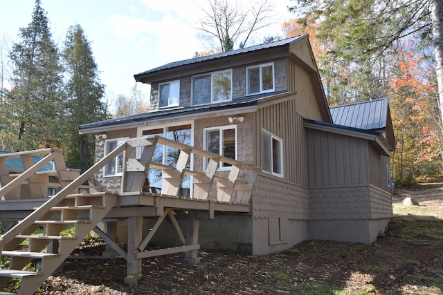 rear view of house with a wooden deck