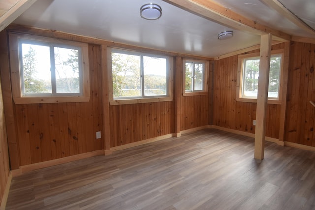 unfurnished sunroom with plenty of natural light and vaulted ceiling