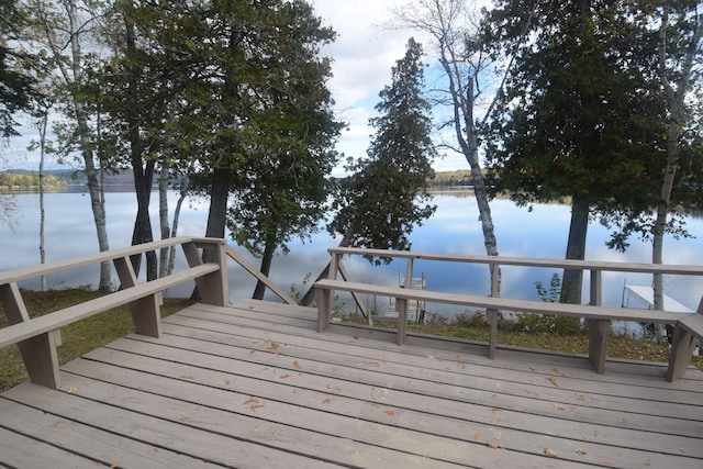 wooden terrace with a water view