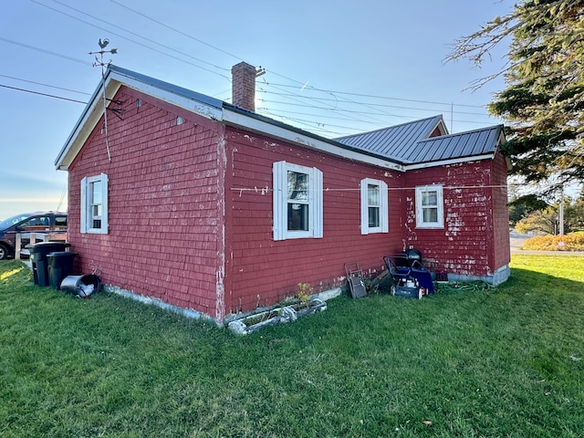 view of home's exterior with a yard