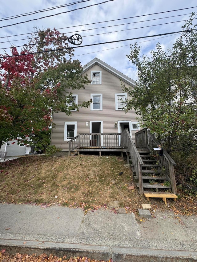 view of front of home with a wooden deck