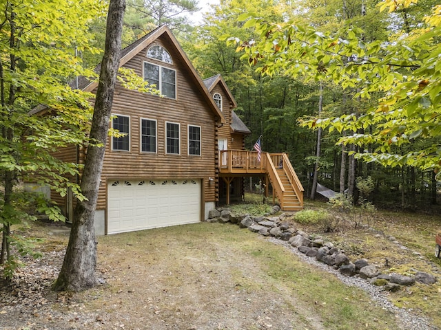 view of front of house with a deck and a garage