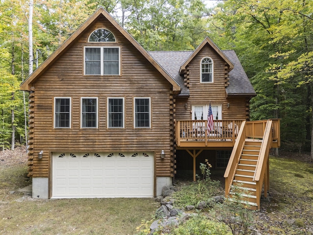 view of front of house featuring a deck and a garage